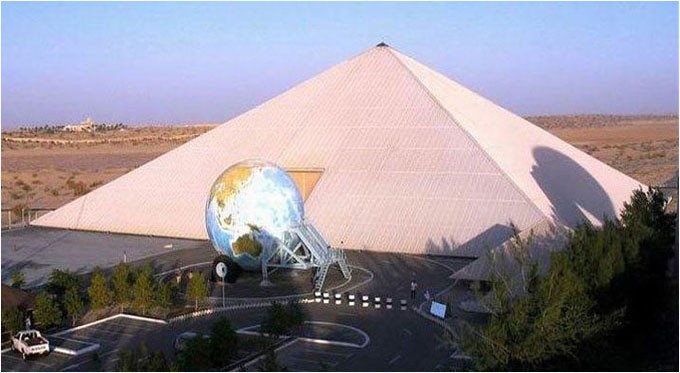 museum pyramid with globe in front