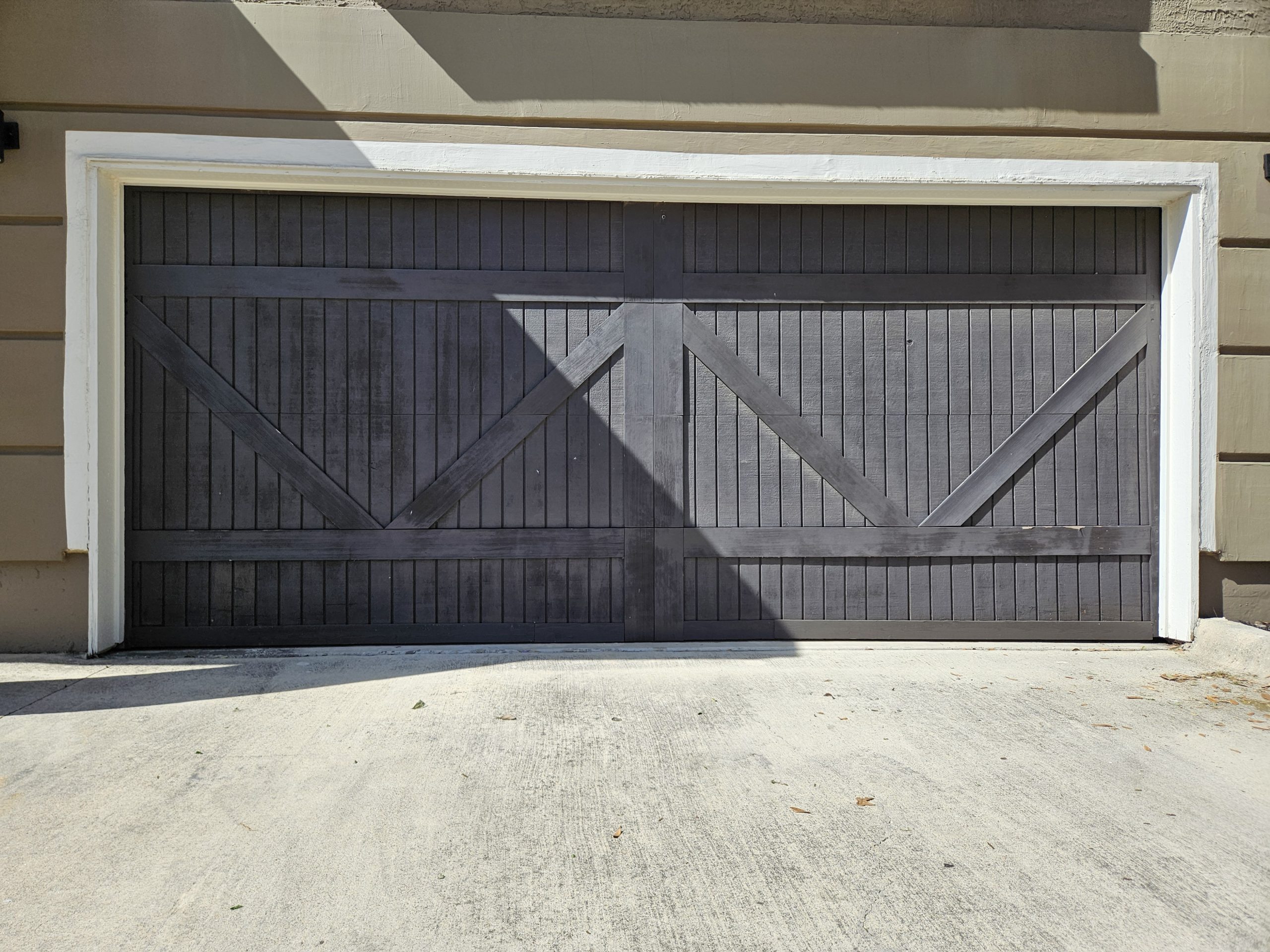 Why is there a gap under my garage door and how can it be fixed?