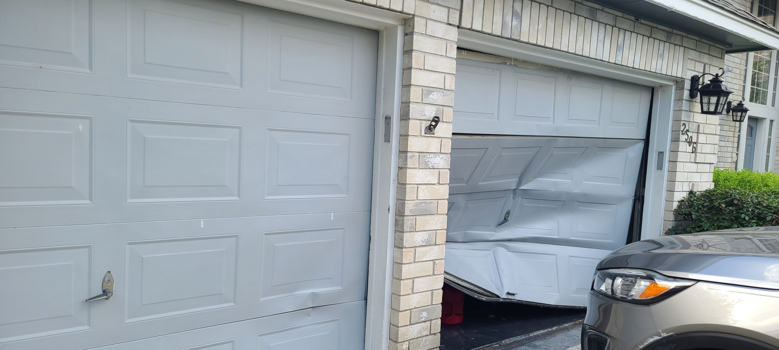 Why is my garage door crumpled, bent, and off track?