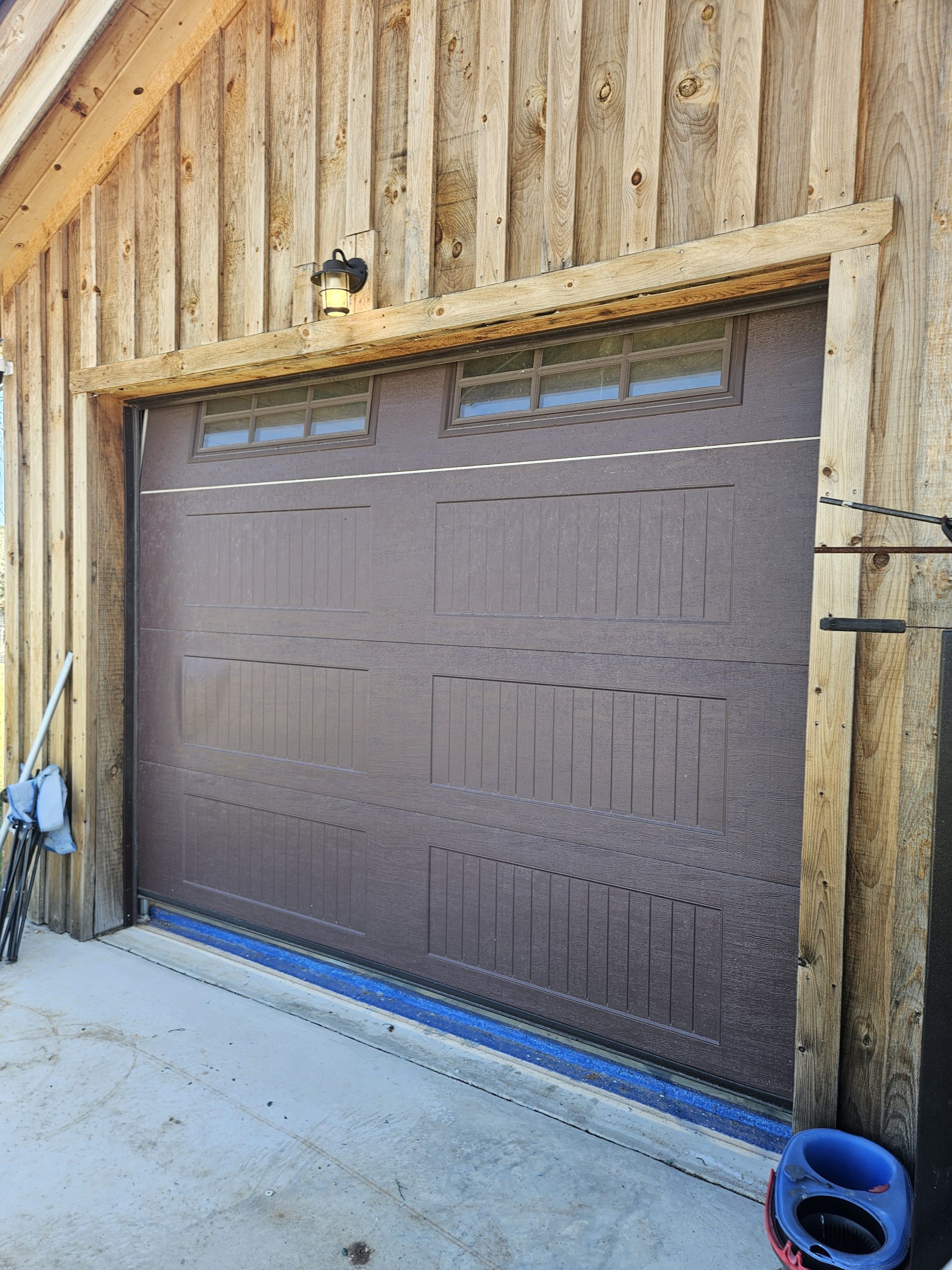 Why is there a gap under my garage door and how can I fix it?
